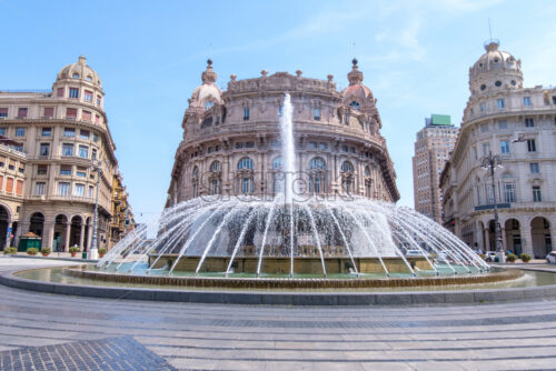 Piazza De Ferrari fountain with buildings on background at daylight. Genoa, Italy - Starpik