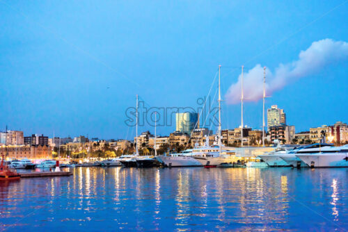 Port Vell at Sunset. Beautiful peaceful view Barcelona, Spain - Starpik