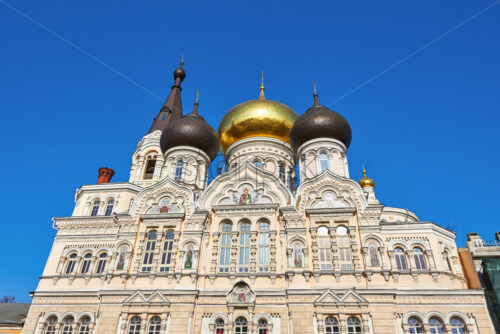 Shot of beautiful orthodox church with gold dome in Odessa, the sky behind is blue and clear - Starpik