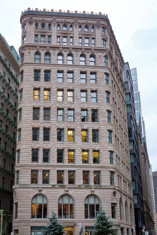 Shot of splendid, gorgeous and high building made in classic style with gray cloudy sky in the background - Starpik