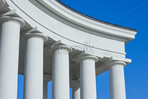 Shot of the beautiful Vorontsov’s colonnades in Odessa with blue and clear sky behind the main scene - Starpik