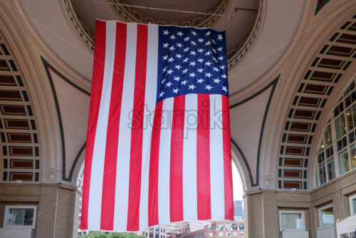 Shot of the huge US flag located inside the Rowes Wharf in Boston, the weather is clear - Starpik