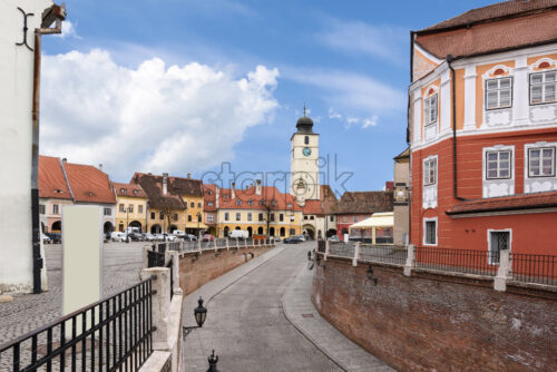 Sibiu city downtown with houses a bridge and a tower with clock, Romania - Starpik