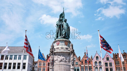 The statue of Jan Breydel and Pieter de Coninck in the Market Square in Bruges, Belgium - Starpik