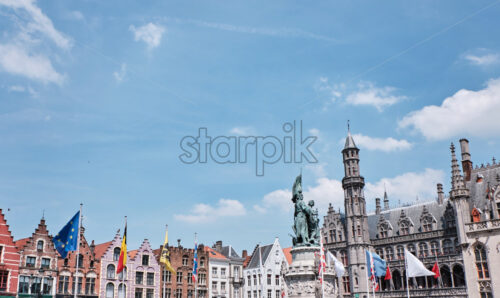 The statue of Jan Breydel and Pieter de Coninck in the Market Square in Bruges, Belgium - Starpik