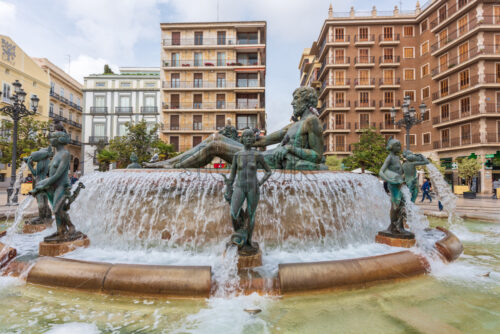 VALENCIA, SPAIN – APRIL 17, 2019: People near a big fountain with some mythological figures - Starpik