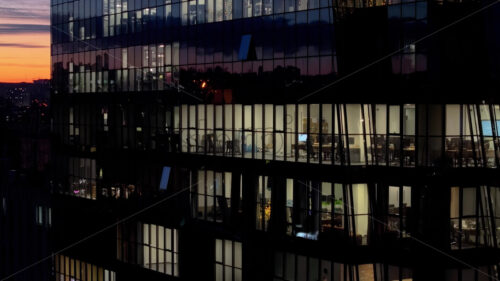 Video Aerial drone view of a glass building in Chisinau, Moldova at sunset, people working at the office - Starpik