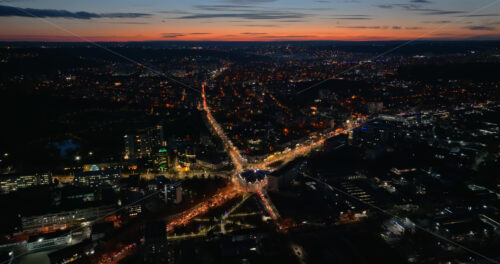 Video Aerial drone view of cars in traffic at a roundabout in Chisinau, Moldova at sunset - Starpik