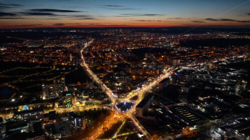 Video Aerial drone view of cars in traffic at a roundabout in Chisinau, Moldova at sunset time lapse - Starpik