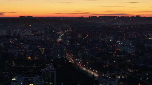 Video Aerial drone view of cars in traffic at a roundabout in Chisinau, Moldova at sunset time lapse - Starpik