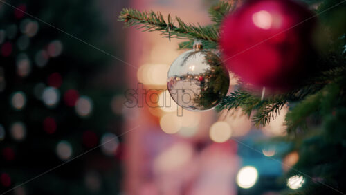 Video Close up of decorations on a Christmas tree in front of the Monte Carlo Casino in Monaco in the evening - Starpik Stock