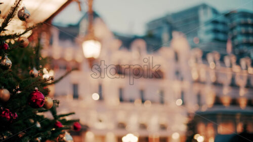 Video Close up of decorations on a Christmas tree in front of the Monte Carlo Casino in Monaco in the evening - Starpik Stock