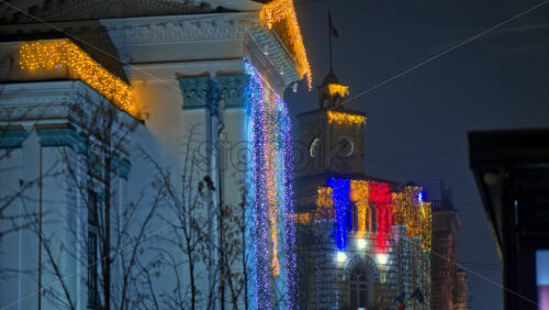 Video Colourful Christmas lights sparking on the Organ Hall and the City Hall on Stefan cel Mare boulevard in Chisinau, Moldova - Starpik Stock