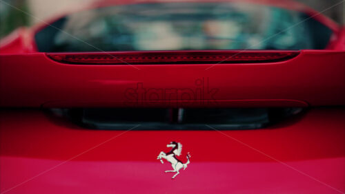 Video Monte Carlo, Monaco – October 24, 2024: Close up of a red Ferrari car in the courtyard of the Monte Carlo Casino in the evening - Starpik Stock