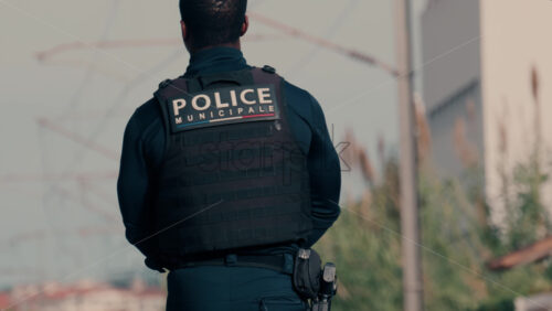 Video Two french police officers walking and patrolling the streets in Nice, France - Starpik Stock