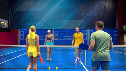 Video Two men and two women high-fiving after playing pickleball on a blue, inside court - Starpik