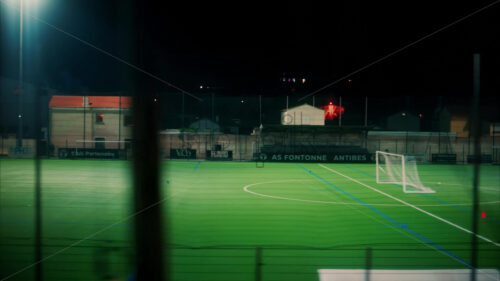 Video View from a train of footballers playing on the field at night - Starpik