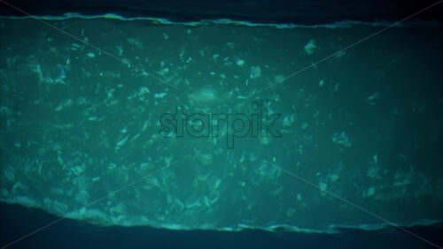 Video View of a reflection on a two toned coloured water - Starpik Stock