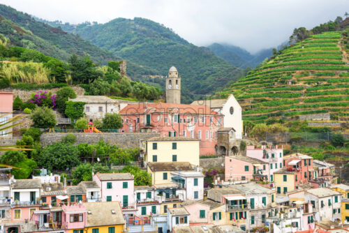 View to city, belltower and green mountains of Vernazza - Starpik