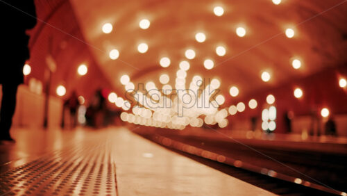 video Blurry view of people and trains moving through the Monaco train station with bright lights in Monte Carlo, Monaco - Starpik Stock