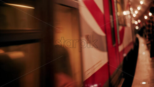 video Blurry view of people and trains moving through the Monaco train station with bright lights in Monte Carlo, Monaco - Starpik Stock