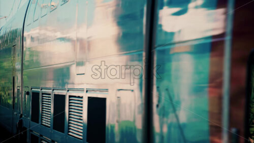 video Close up of a blue train moving on the rails near a station in France - Starpik Stock