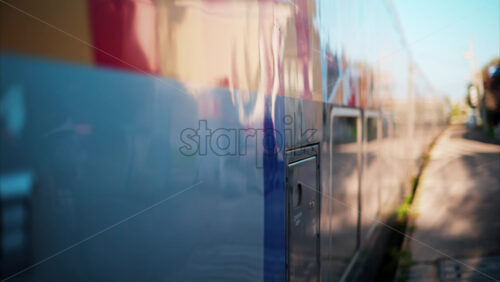 video Close up of a blue train stopping at the station in France, with people waiting to enter it - Starpik Stock