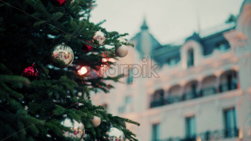 video Close up of decorations on a Christmas tree in front of the Monte Carlo Casino in Monaco - Starpik Stock