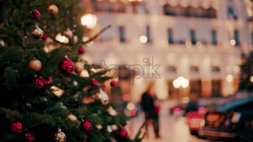 video Close up of decorations on a Christmas tree in front of the Monte Carlo Casino in Monaco in the evening - Starpik Stock