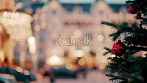 video Close up of decorations on a Christmas tree in front of the Monte Carlo Casino in Monaco in the evening - Starpik Stock