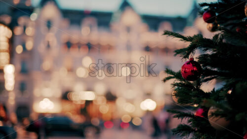 video Close up of decorations on a Christmas tree in front of the Monte Carlo Casino in Monaco in the evening - Starpik Stock