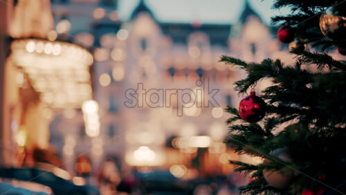 video Close up of decorations on a Christmas tree in front of the Monte Carlo Casino in Monaco in the evening - Starpik Stock