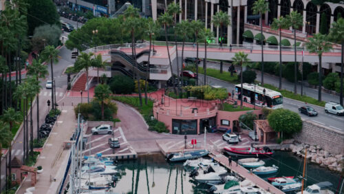 video La Condamine, Monaco – October 4, 2024: View of boats docked in the Monaco Marina with the skyline of the city on the background - Starpik Stock