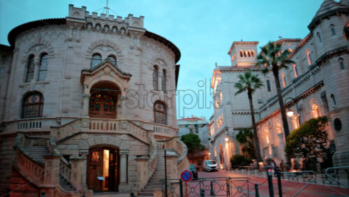 video Monaco City, Monaco – September 4, 2024: The facade of the Palace of Justice in the Old Town in the evening - Starpik Stock