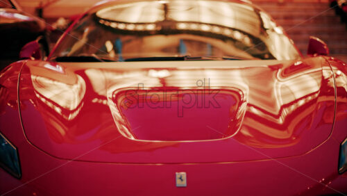 video Monte Carlo, Monaco – October 24, 2024: Close up of a red Ferrari car in the courtyard of the Monte Carlo Casino in the evening - Starpik Stock