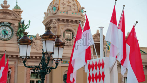 video Monte Carlo, Monaco – October 24, 2024: The coat of arms of Monaco and multiple flags waving in front of the Monte Carlo Casino - Starpik Stock