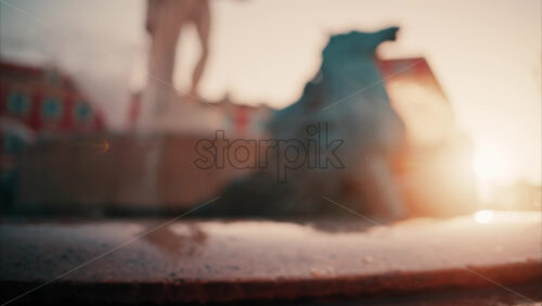 video Nice, France – October 8, 2024: Blurry view of the Fontaine du Soleil in Place Massena at sunset - Starpik Stock