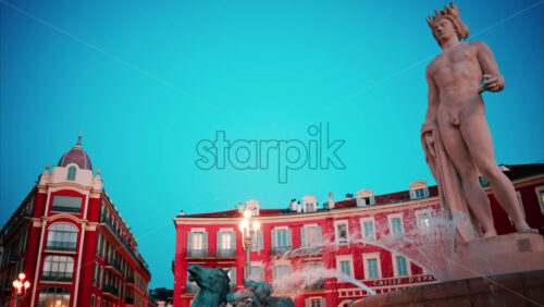 video Nice, France – October 8, 2024: Close up of the Fontaine du Soleil at Place Massena in the evening - Starpik Stock