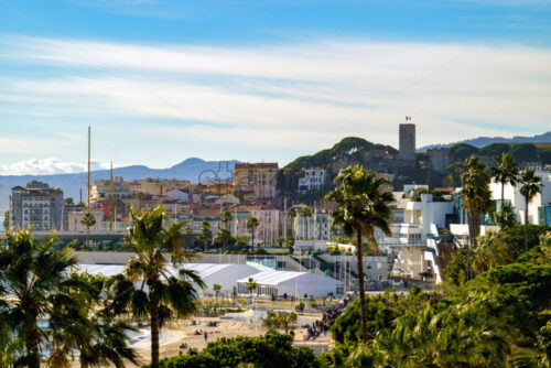 Cannes beach and castle, buildings and palm trees, France - Starpik Stock