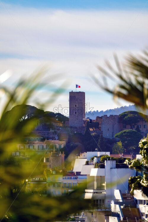 Cannes beach and castle, buildings and palm trees, France - Starpik Stock